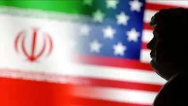 Silhouette of a man's profile against a blurred background showing the Iranian flag and the U.S. flag.